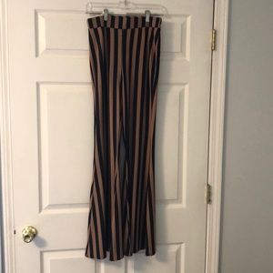 Stretchy form fitting pants with flare